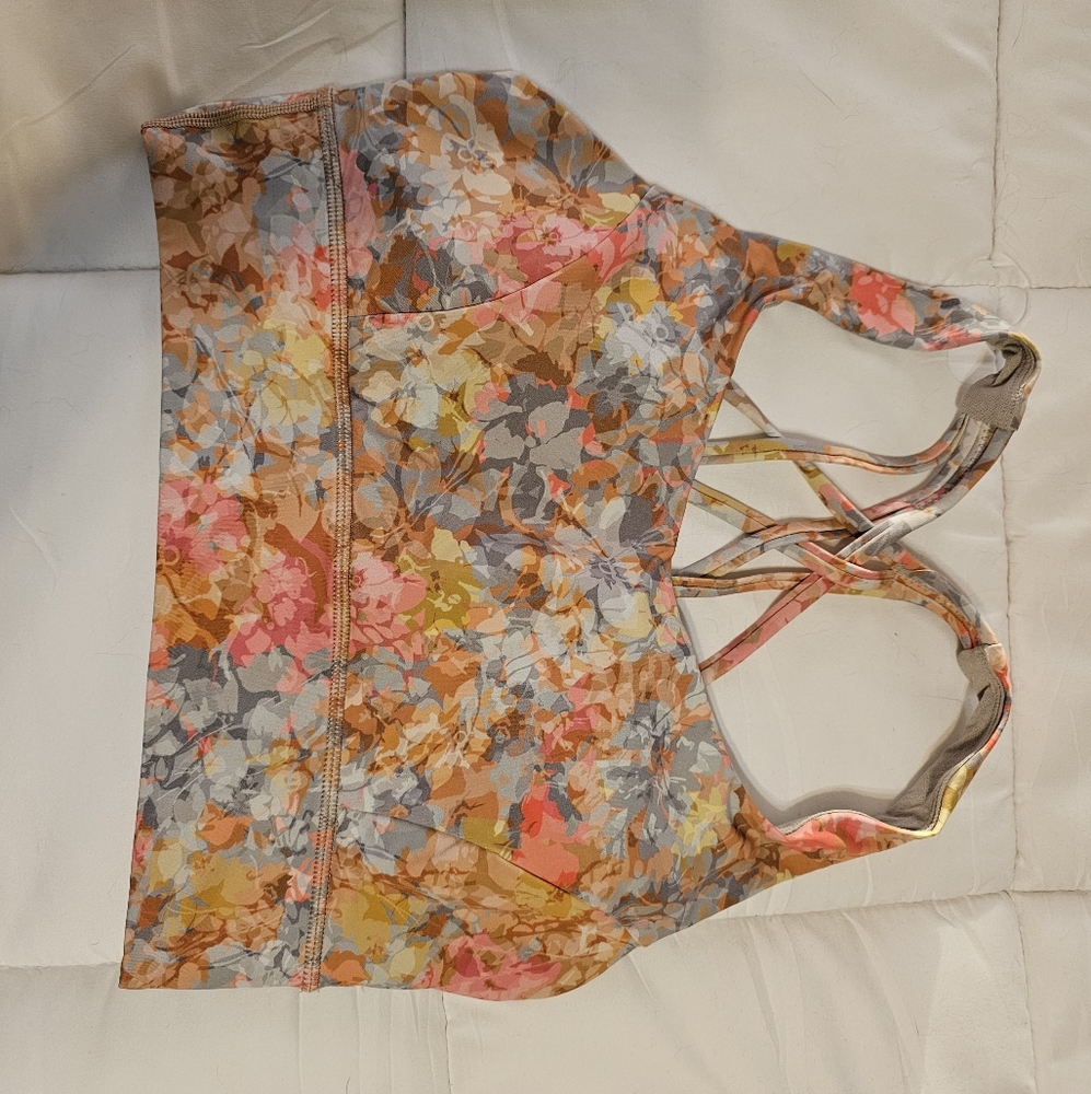Set of 2 sport bras and 1 pair of leggings. All coordinating. Discontinued print